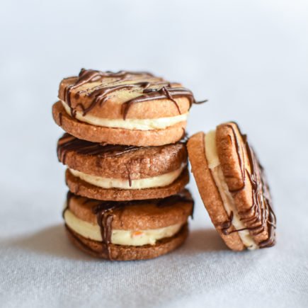 Zandkoekjes - Crème au beurre van sinaasappel - Chocolade