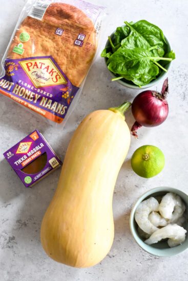 Pompoencurry met scampi, spinazie & hot honey naan
