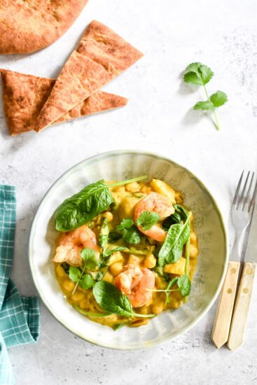 Pompoencurry met scampi, spinazie & hot honey naan