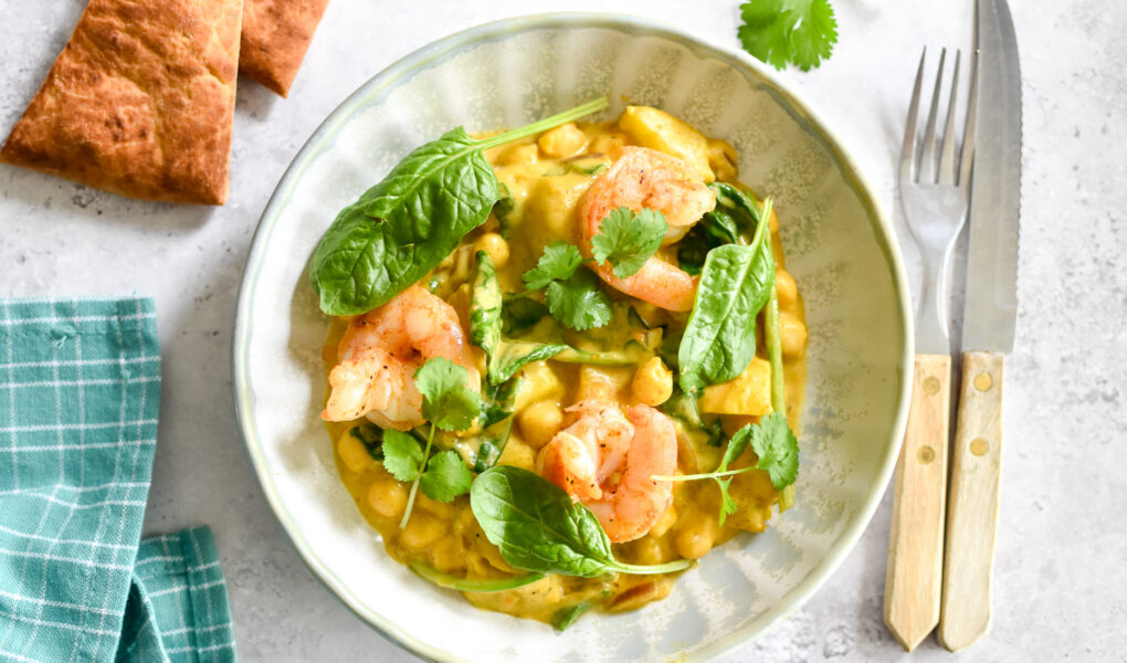 Pompoencurry met scampi, spinazie & hot honey naan