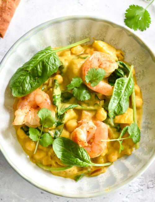 Pompoencurry met scampi, spinazie & hot honey naan