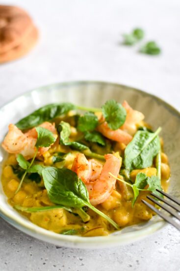 Pompoencurry met scampi, spinazie & hot honey naan