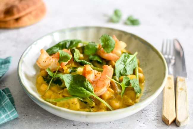 Pompoencurry met scampi, spinazie & hot honey naan